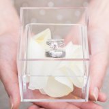 Clear Acrylic Wedding Ring Box in Groom's Hands